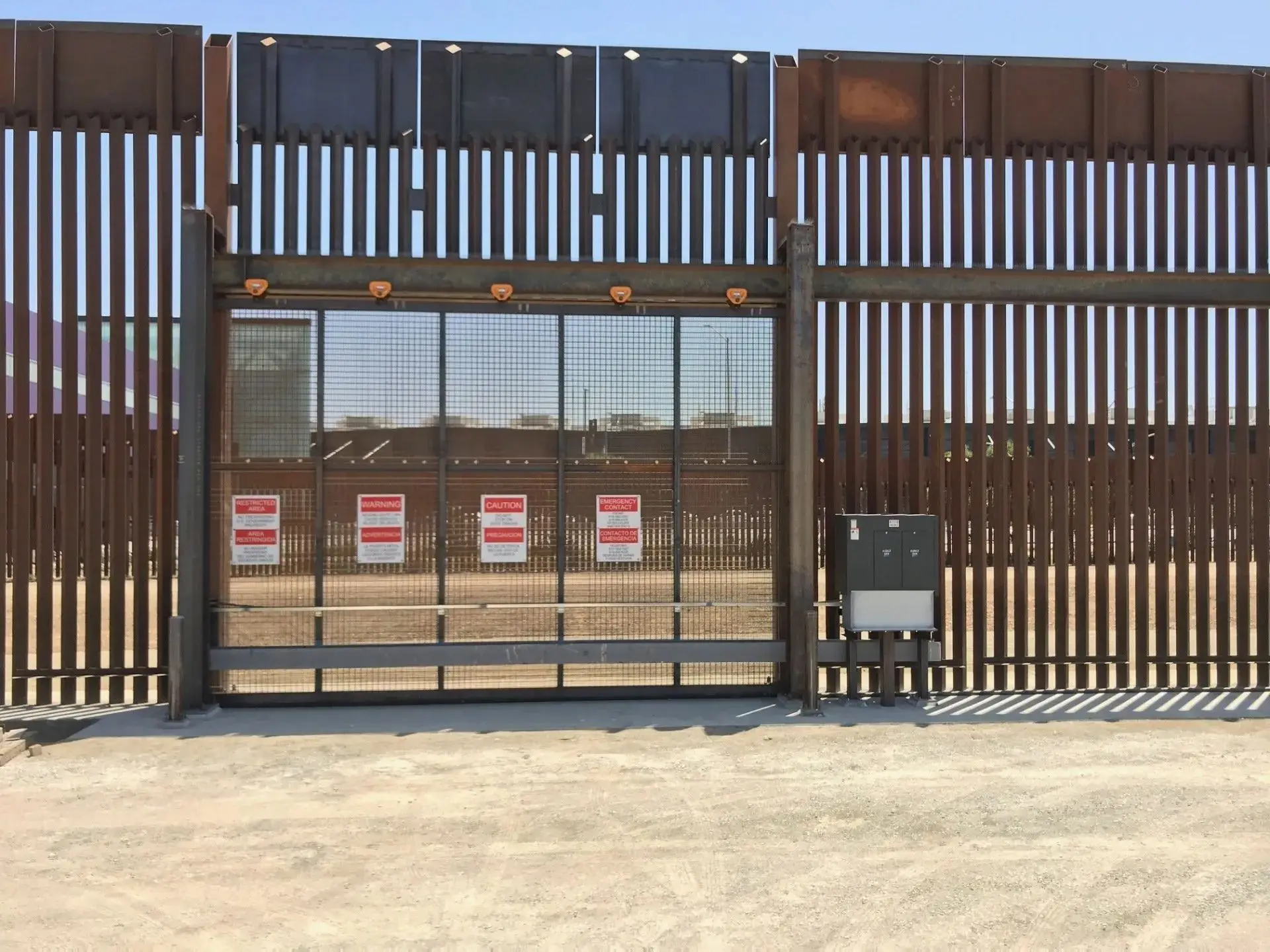 A CES technician working on an automated security gate installation